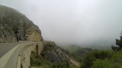 Car in mountain mist